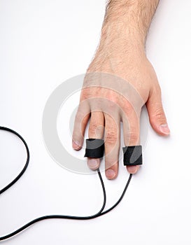 Man's Hand with Polygraph Electrodes photo