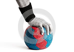 Man`s Hand Pressing Down on Handball
