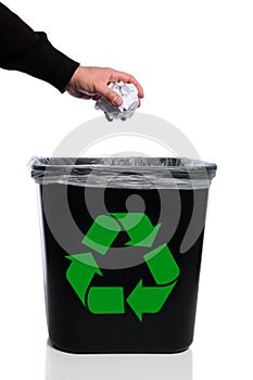 Man's Hand Putting Trash in Recycle Can