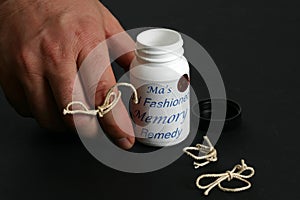 Man's hand reaching for memory aid