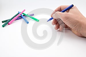 The man's hand, ready to draw a picture