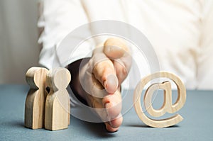 A man`s hand separates people from the Internet. The concept of blocking access to the World Wide Web, self-isolation and traffic photo