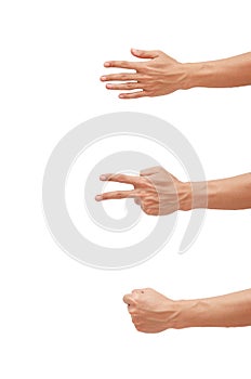 Man`s hand showing a game Rock-paper-scissors