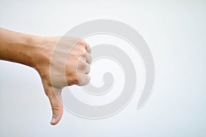 Man`s hand showing is not likeable feeling on isolated,white background photo