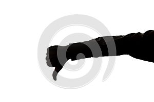 Man`s hand shows a thumb down - silhouette
