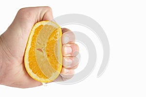 Man's hand squeezing Orange