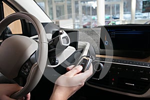 The man`s hand on the steering wheel