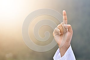 A man`s hand with a tauhid symbol isolated on blur background