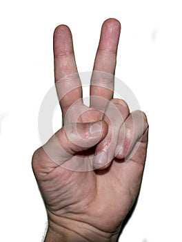 Man's hand with two fingers raised. The sign of victory.