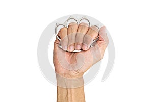 Man`s hand wearing iron knuckle-duster, hand`s weapon