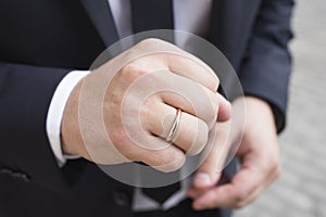 Man`s hand with a wedding ring, close-up