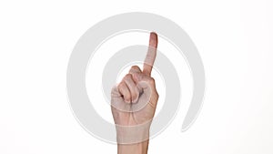 A man`s hand on a white background of isolate shows a finger that denies. Place to insert text or background. Emotions