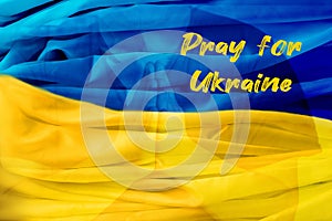 Man`s hands folded in prayer. Pray for Ukraine