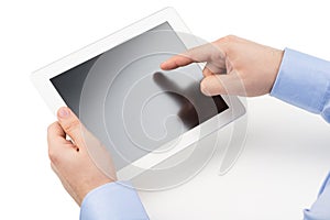 Man's hands are holding a tablet computer and points a finger at