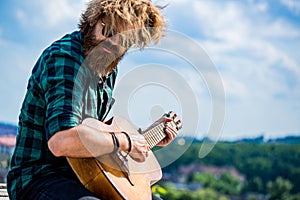 Man's hands playing acoustic guitar, close up. Acoustic guitars playing. Music concept. Guitars acoustic. Male