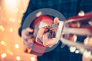 Man`s hands playing acoustic guitar, close up. Music concept