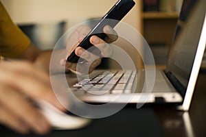 Man`s hands teleworking from home photo