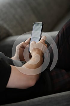 man's hands typing on cell phone photo
