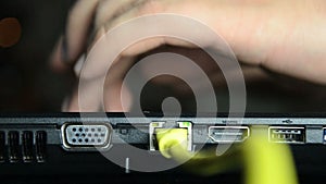 Man's hands typing on laptop keyboard.