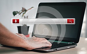 Man's hands are using a computer keyboard to Searching for information data. The concept is Technology Search Engine