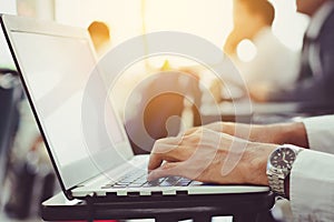 man`s hands using laptop with copy space on blur