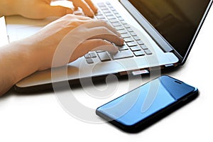 Man`s hands using laptop