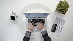 Man`s Hands Working on the Laptop