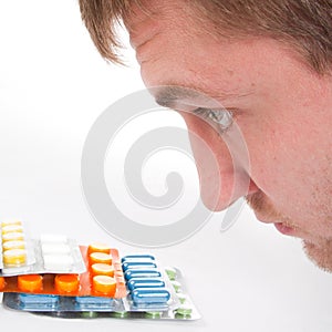 Man's head and colorful medicines