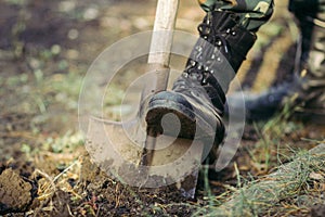 A man`s leg in a military boot