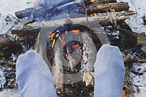 Man's legs against the bonfire