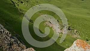 Man`s legs in flip flops on rock. Tilt of wild nature on plateau Bermamyth.