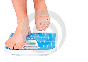 Man's legs ,weighed on floor scale.