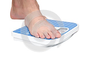Man's legs ,weighed on floor scale.