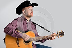 The man`s portrait in a cowboy`s hat. photo