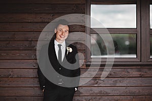 Man`s style. Elegant young man. Close-up portrait of the man in a luxury classic trendy suit. portrait of the groom