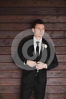 Man`s style. Elegant young man. Close-up portrait of the man in a luxury classic trendy suit. portrait of the groom