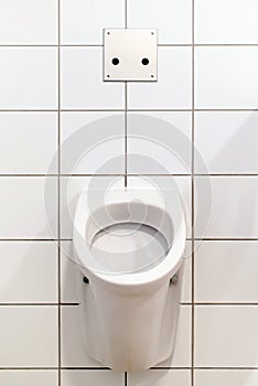 Man`s toilet. Urinal. White clean urinals in public restroom. Public man toilet