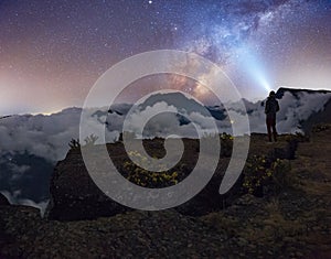 Man`s watching the milkyway at Maido in Saint-Paul, Reunion Island photo