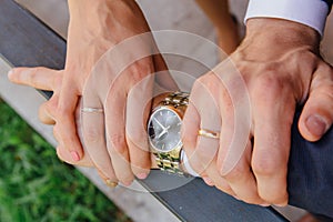 Man's and woman's hands with wedding rings