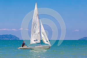 Man sailing. Boy learning to sail on sea yacht