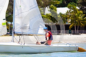 Man sailing. Boy learning to sail on sea yacht