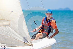 Man sailing. Boy learning to sail on sea yacht