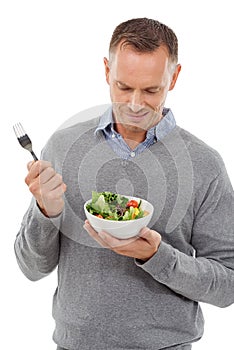 Man with salad, frown on face and vegetable, problem with healthy lifestyle and diet isolated on white background