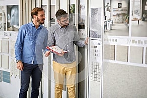 Man with salesman in store for the house