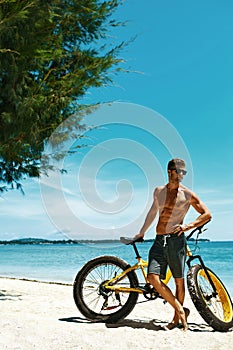 Man With Sand Bike On Beach Enjoying Summer Travel Vacation