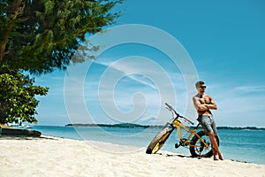 Man With Sand Bike On Beach Enjoying Summer Travel Vacation