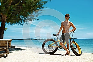 Man With Sand Bike On Beach Enjoying Summer Travel Vacation