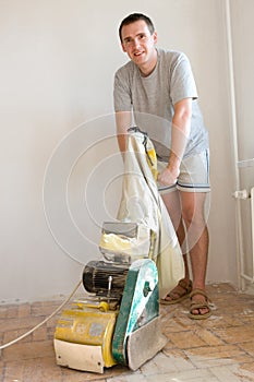 Man Sanding Floor