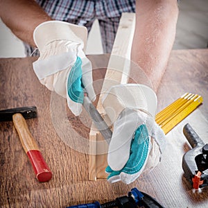 Man sanding a wood in a workshop