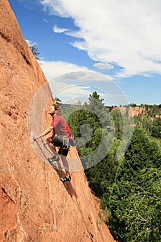 Man sandstone rock climbing